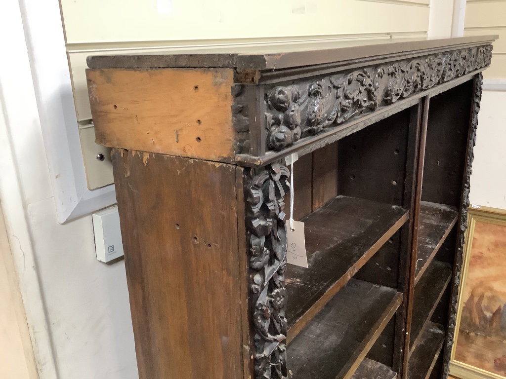 A 19th century Flemish carved oak open bookcase (adapted), length 150cm, depth 28cm, height 152cm